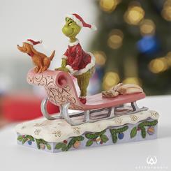 Celebra la época festiva con una encantadora figura del Grinch en trineo, inspirada en los clásicos cómics de Dr. Seuss "How the Grinch Stole Christmas". El talentoso artista Jim Shore