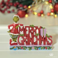 Celebra la Navidad de una manera única con la señal "Grinch Merry Grinchmas Word" de Jim Shore. Este colorido letrero te desea una Feliz Navidad Grinch con rosas y muérdago.