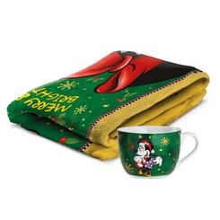 Calidez instantánea con espíritu navideño. El Magic Winter – Giftset Plaid & Breakfast Cup Minnie Mouse reúne una manta de tacto suave con diseño invernal a todo color y una taza de desayuno a juego 
