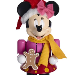 Figura de Minnie Mouse basado en el popular personaje de Walt Disney, esta vez tenemos a Minnie con una galletita de jengibre como si fuera un cascanueces de Navidad. 