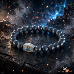 Pulsera Matrix of Leadership de Transformers con licencia oficial de Hasbro. Tiene unos 19 cm de circunferencia, elástico extensible, cuentas de metal de hematita y una pieza central con piedra azul y detalles plateados y dorados.
