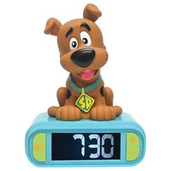 Despertador digital con luz nocturna 3D de Scooby Doo con pantalla LCD y alarma ajustable. Incluye efectos de sonido y figura tridimensional del personaje sobre la base azul clara.