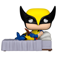 Figura POP Deluxe Marvel Lobezno en vinilo, con el personaje recostado en una cama y sosteniendo un libro. Presentada en caja regalo, combina el diseño clásico de Lobezno con una base original y detallada.