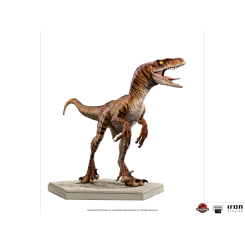 Figura Velociraptor de The Lost World: Jurassic Park a escala 1/10 con un diseño naranja rayado y ojos amarillos. Montada sobre pedestal con el logo de la película, refleja la versión masculina del dinosaurio en la segunda entrega de la saga.